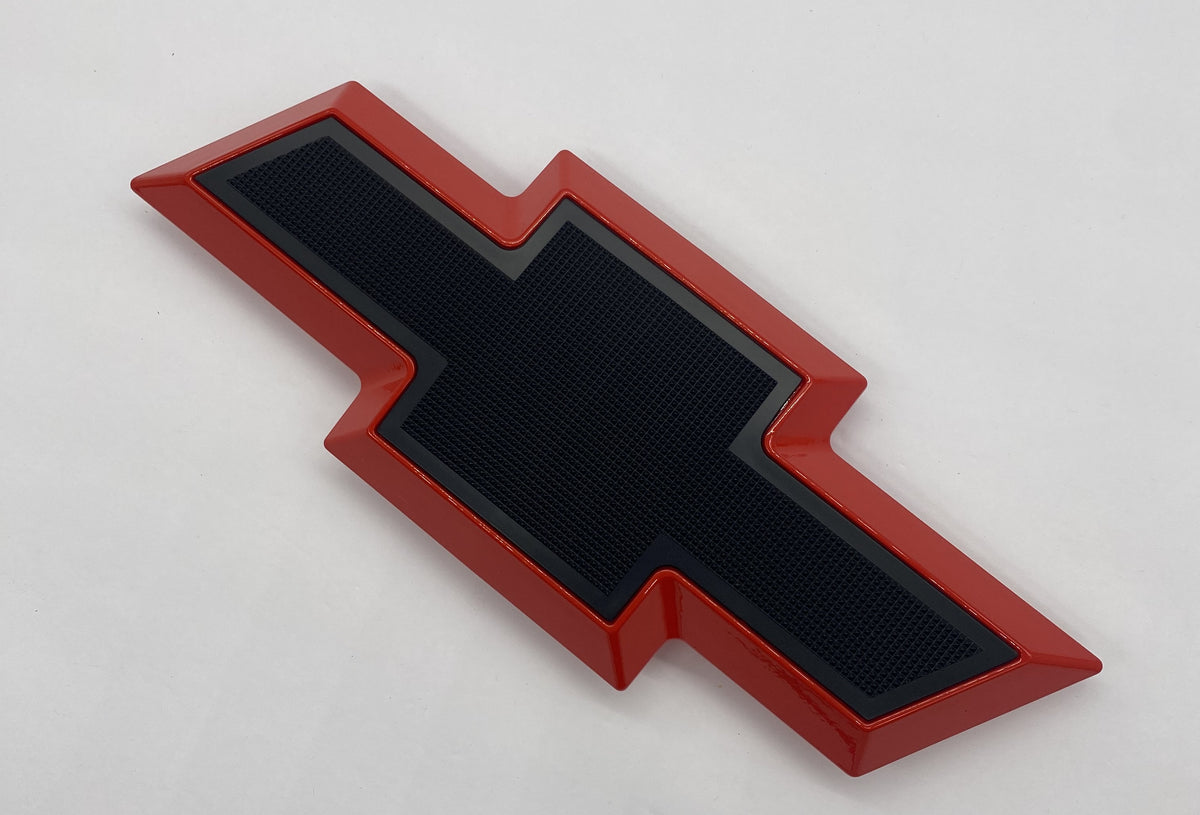 Front grille bowtie emblem for Chevy Silverado HD 2011-2014, red with black center, side angle